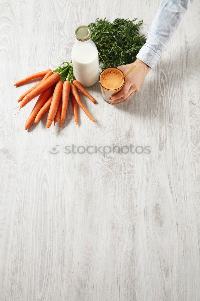 Similar – process of cutting slices of carrot on a kitchen board