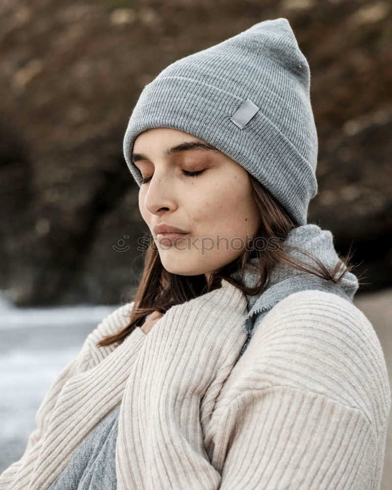 Similar – young hooded woman in a white sweatshirt with a serious look