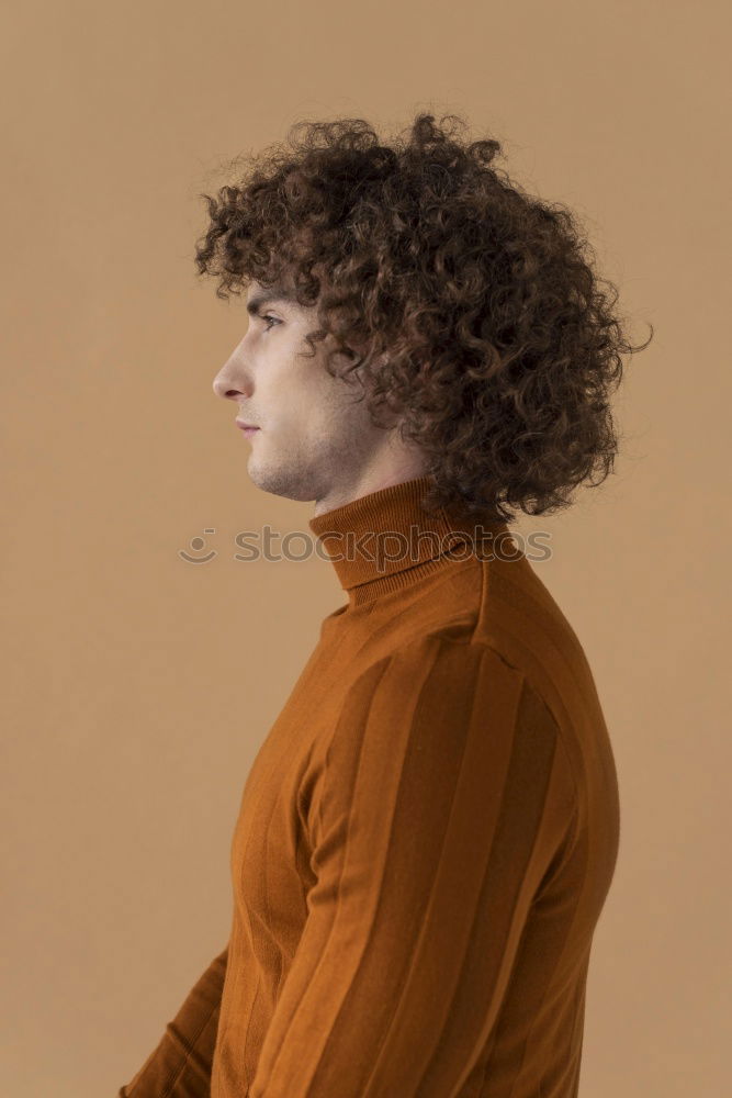 Similar – Image, Stock Photo young man with curly hair looking at camera with his longboard or skeateboard on his shoulders in the middle of the street