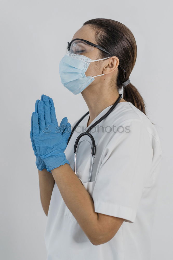 Similar – portrait of doctor woman wearing protective mask and gloves indoors. Using mobile phone. Corona virus concept