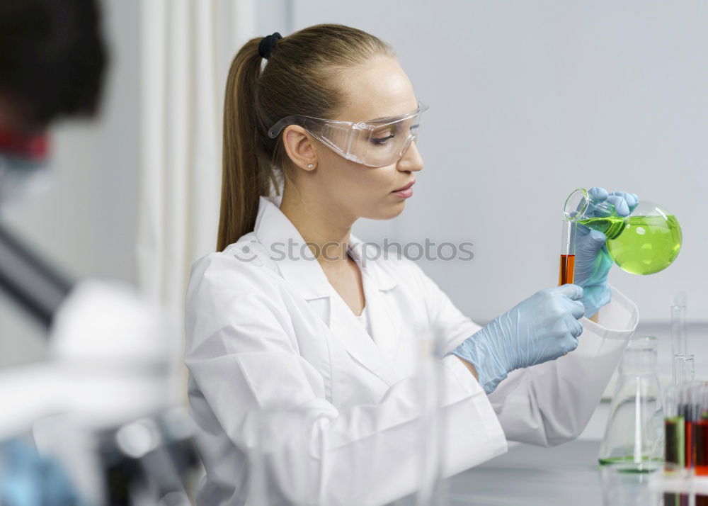 Similar – Image, Stock Photo Woman holding flask in lab