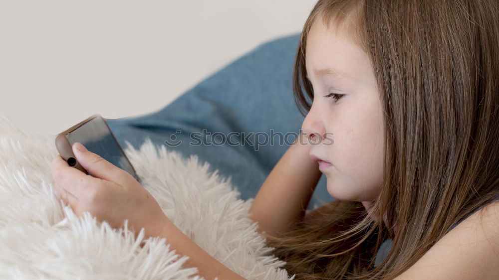 Similar – Image, Stock Photo Teenage girl listening to music and chatting with friends on smartphone sitting in hammock at home