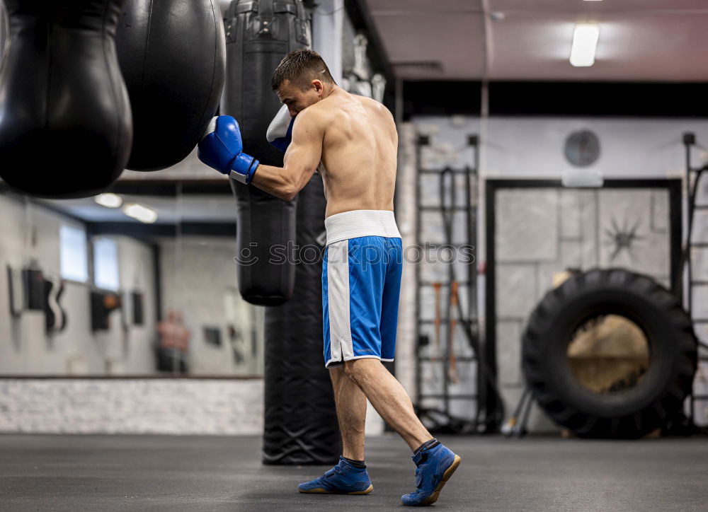 Similar – Image, Stock Photo Young thai boxing man is doing a workout for fight