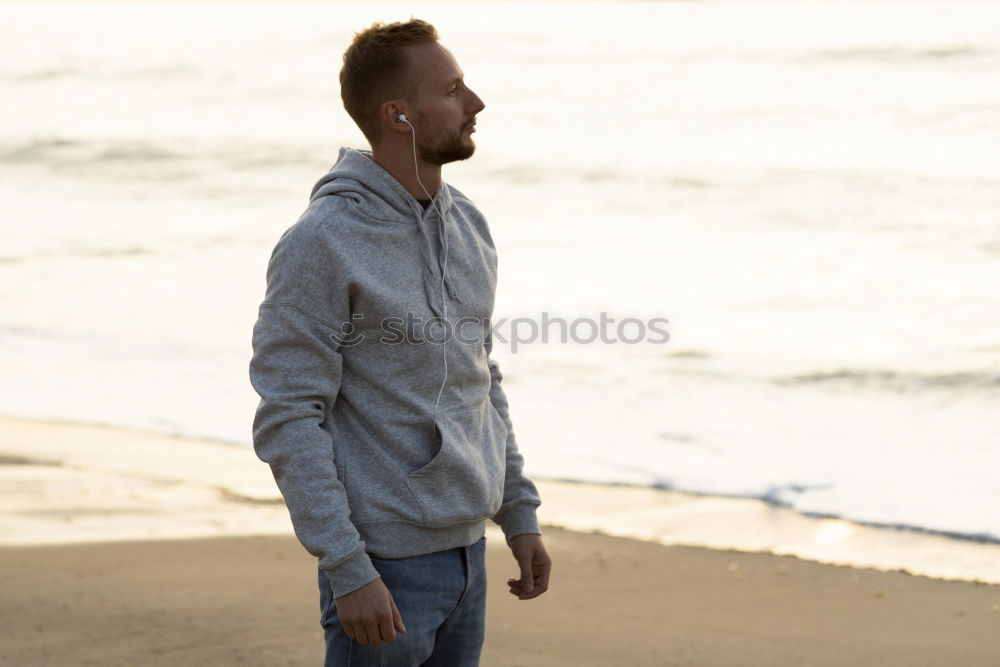 Similar – Cheerful bearded man with headphones