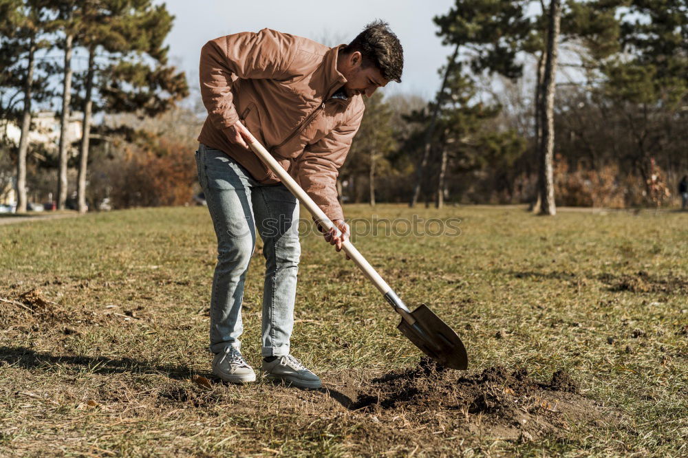 Image, Stock Photo Boy with heap of garbage in hands near basket