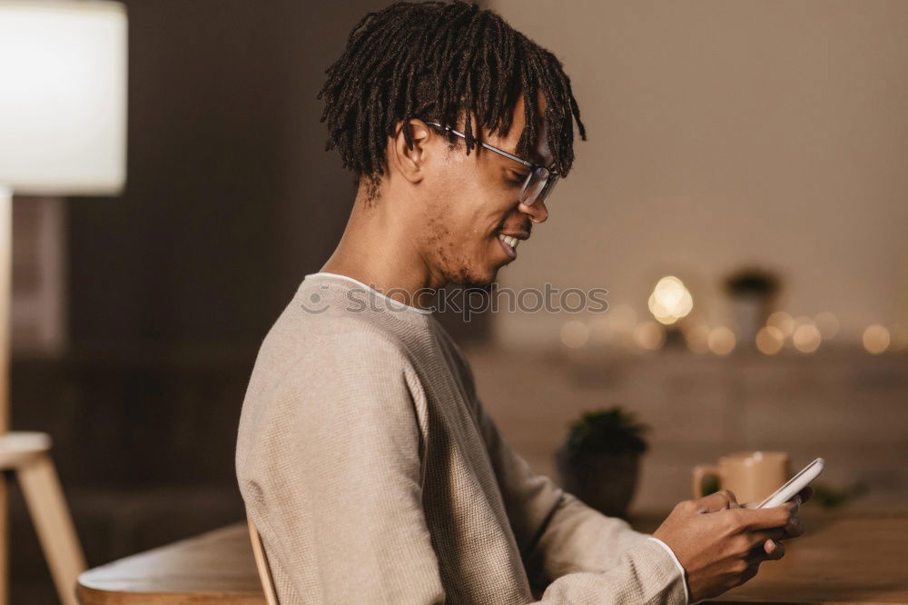 Similar – Image, Stock Photo Young black man using smart phone outdoors