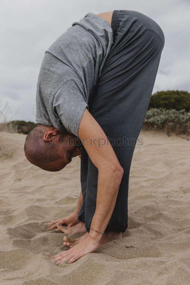 Similar – Man doing yoga in nature.