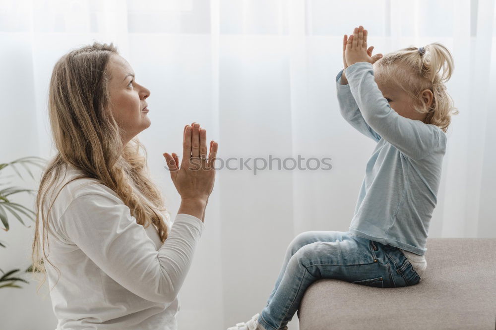 Similar – happy mother and child son fooling and playing in bed