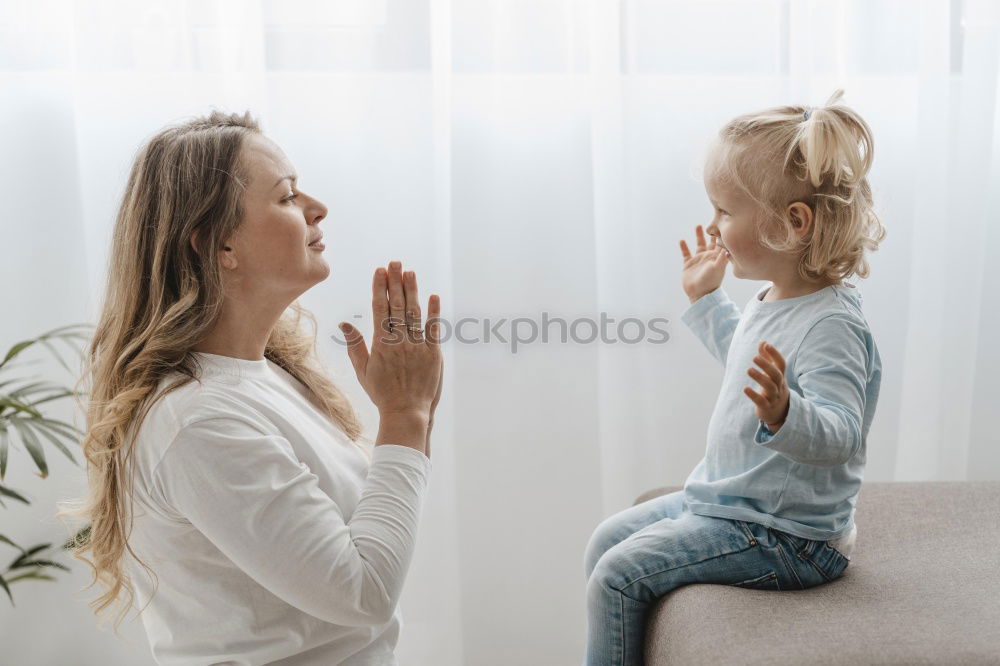 Similar – happy mother and child son fooling and playing in bed