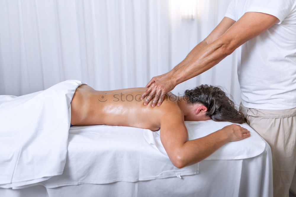 Similar – Young man having massage in spa