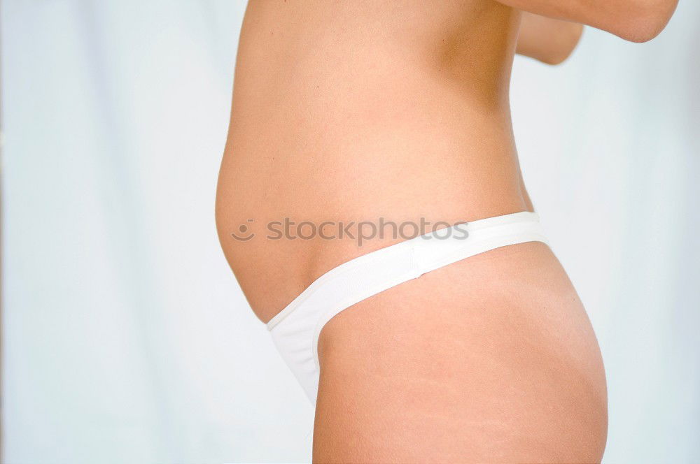 Similar – Image, Stock Photo Red bikini woman’s waist isolated on pink background. Mature woman fit body