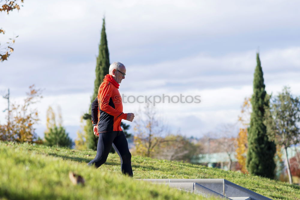 Side view of one senior caucasian athlete man training