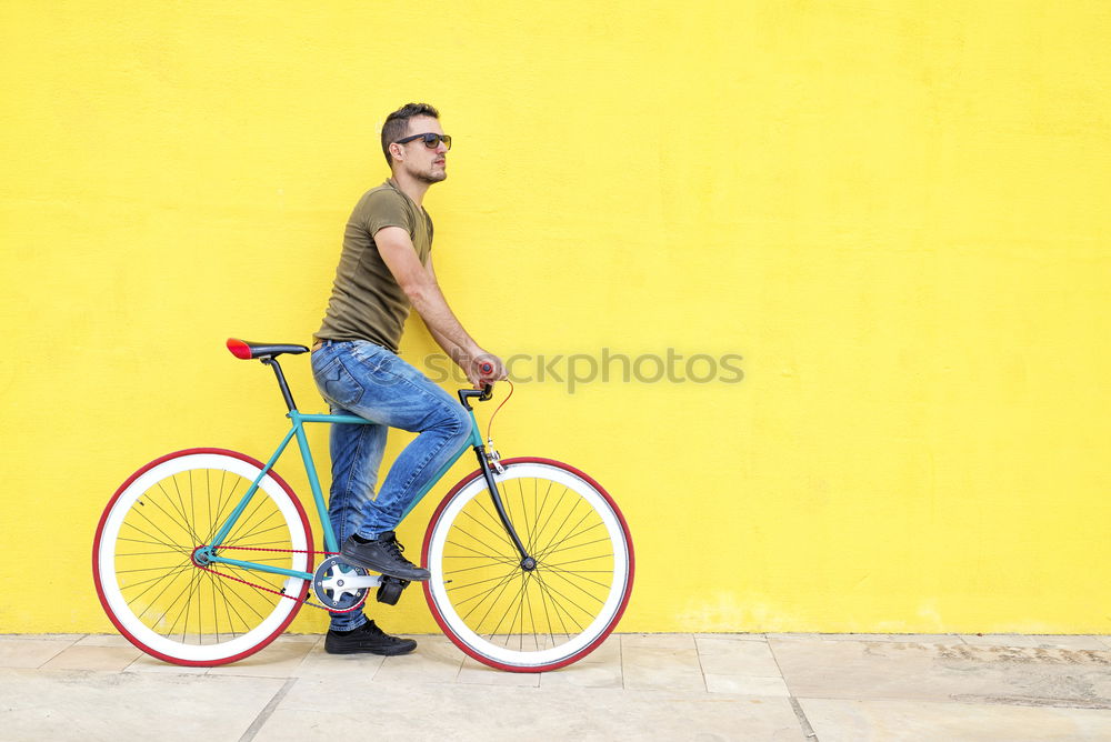 Image, Stock Photo Side view of a young hipster man with a fixed bike