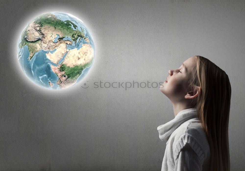 Similar – Pupil girl pointing at globe