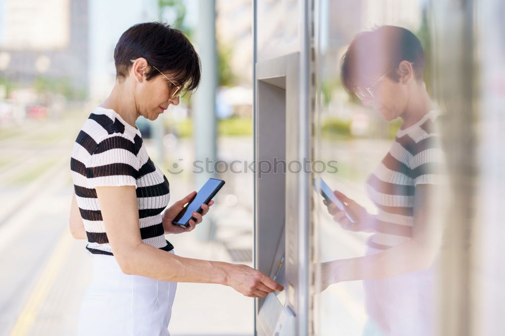 Similar – Attractive blond woman checking her mobile phone