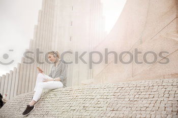 Similar – Image, Stock Photo Young handsome trendy man with coat posing with an old wall background