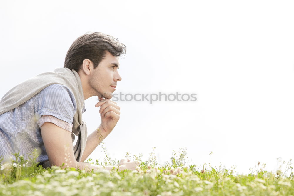 Young handsome man with sun hat in urban background