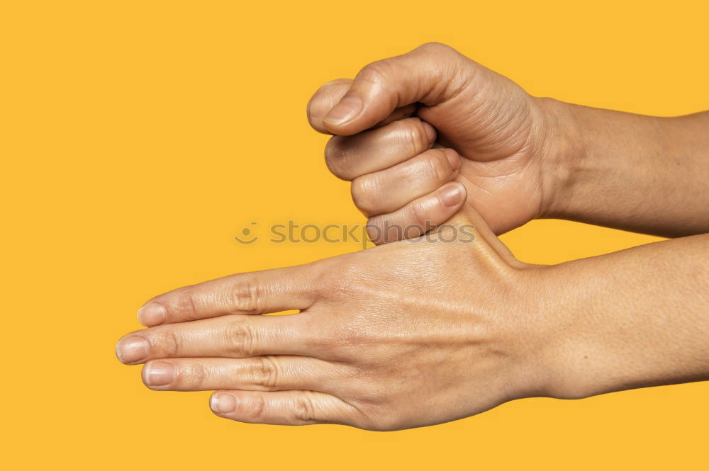 Similar – Image, Stock Photo Forearm and hand with spread fingers against a yellow background