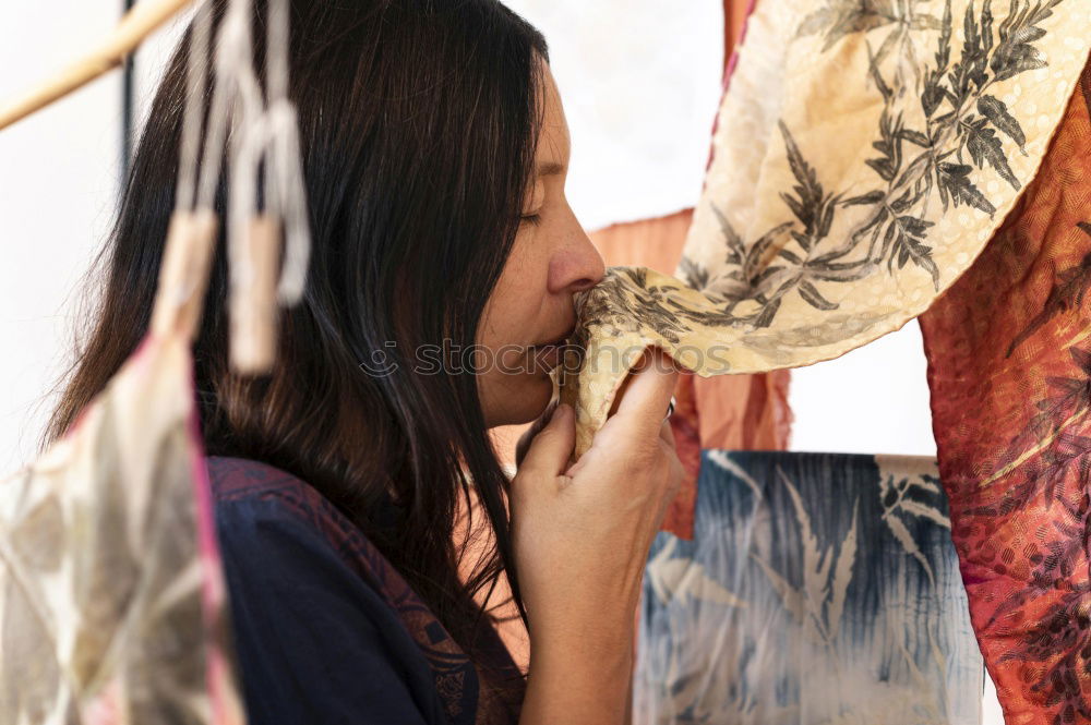 Woman fanning herself.