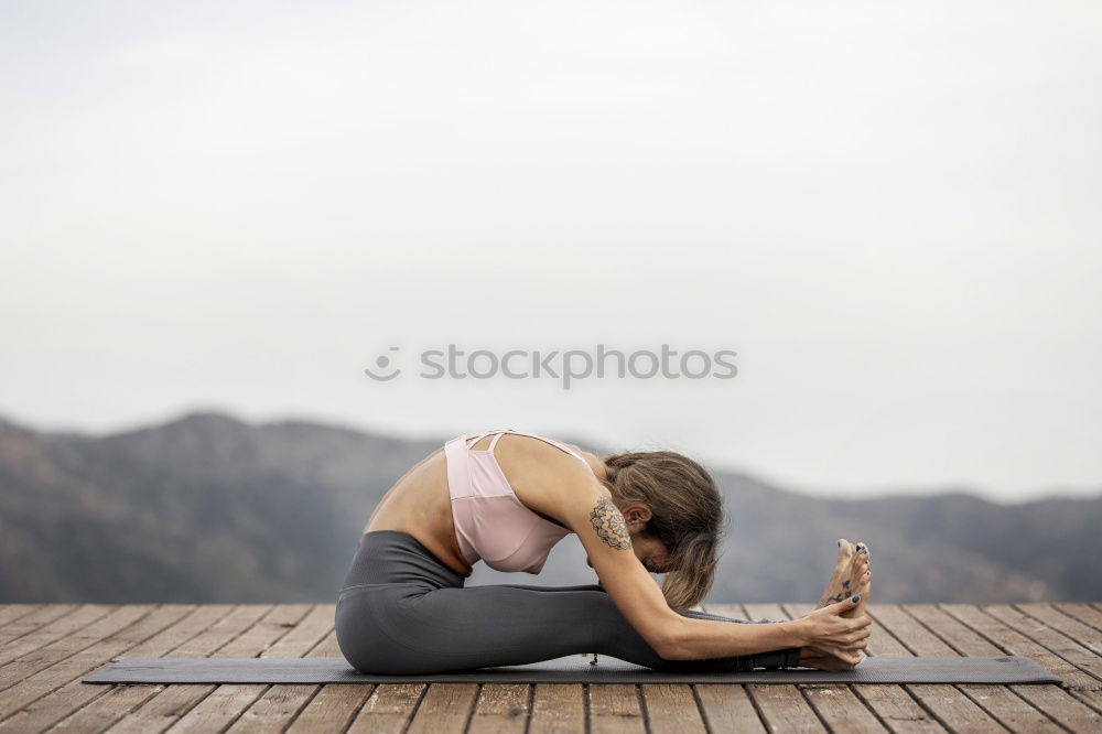 Similar – Image, Stock Photo Attractive woman working out on a wooden deck