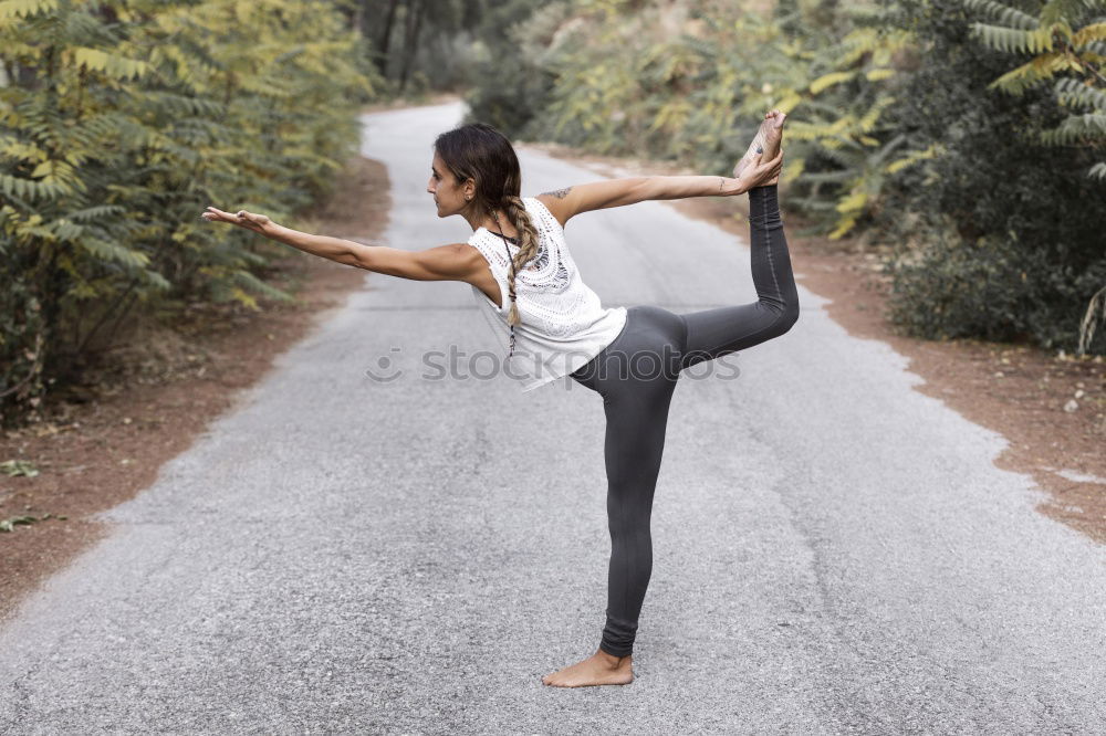 Similar – Image, Stock Photo Young woman doing yoga on wooden road in nature.