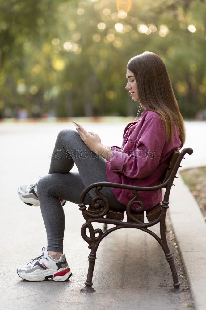 Similar – Attractive teenager sitting on steps in town