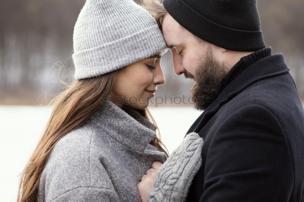 Similar – Young couple embracing and laughing outdoors under umbrella