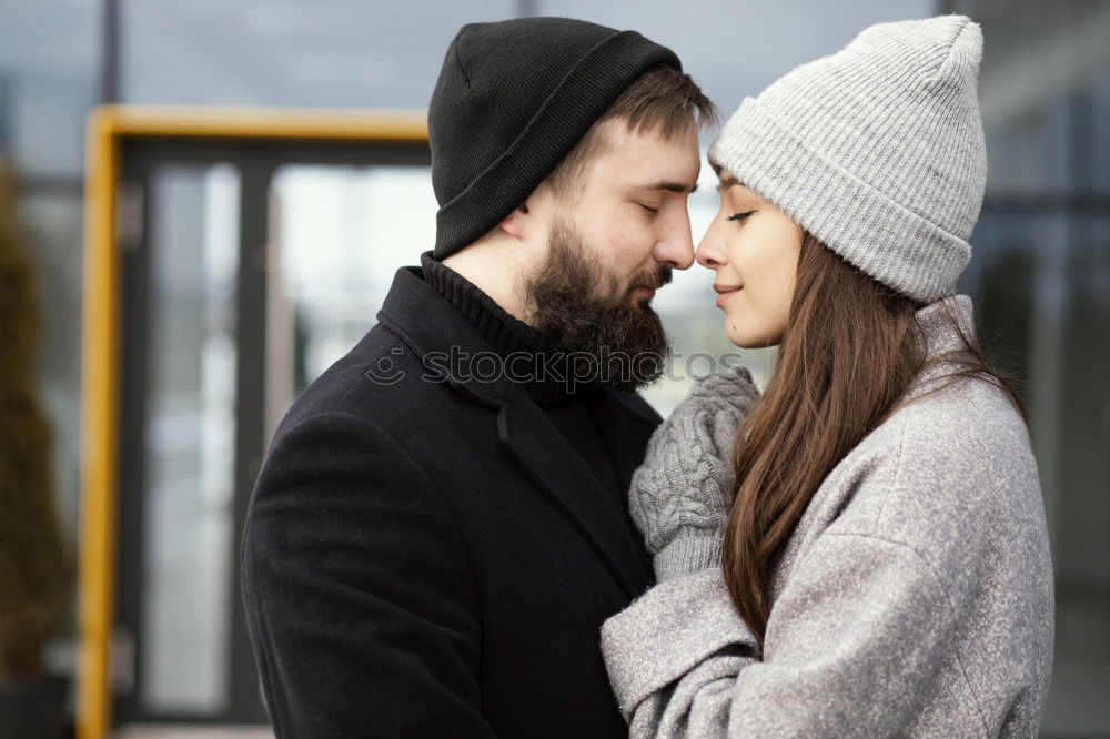 Similar – Young couple embracing and having hot beverage outdoors