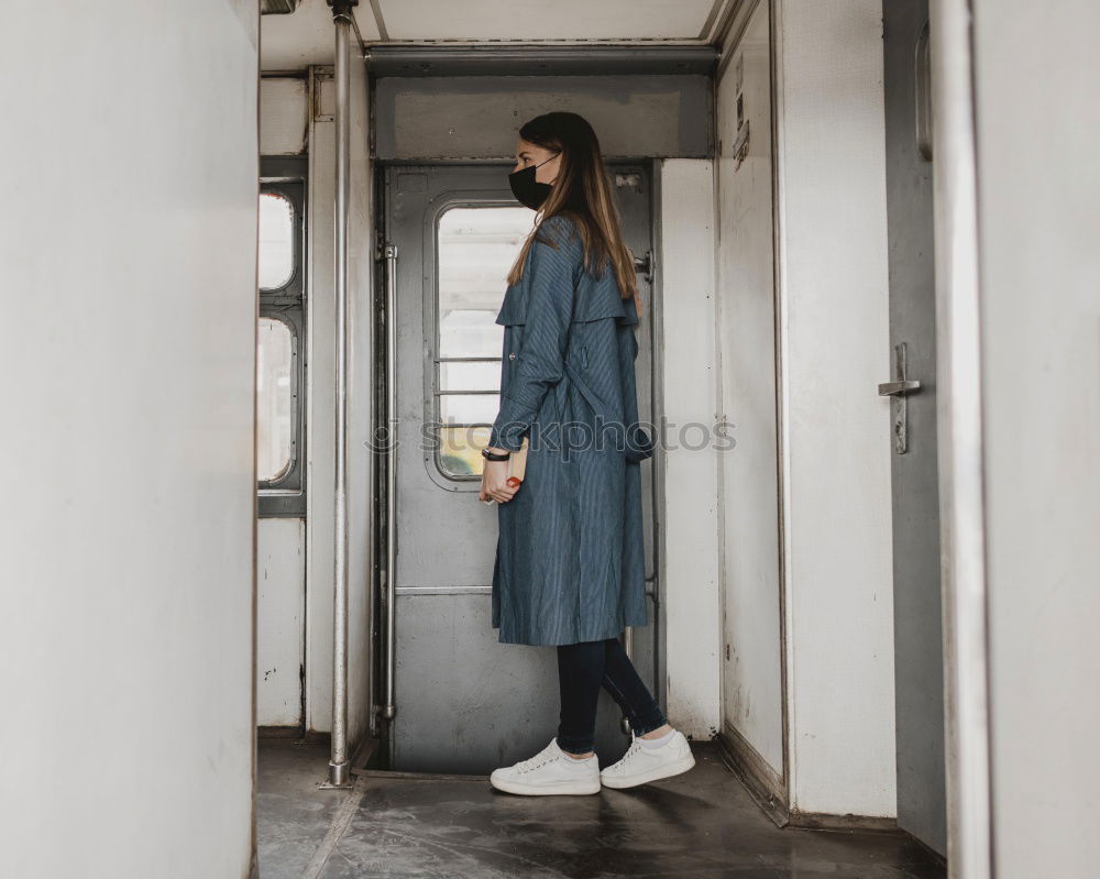 Similar – Young woman stands in front of a bus