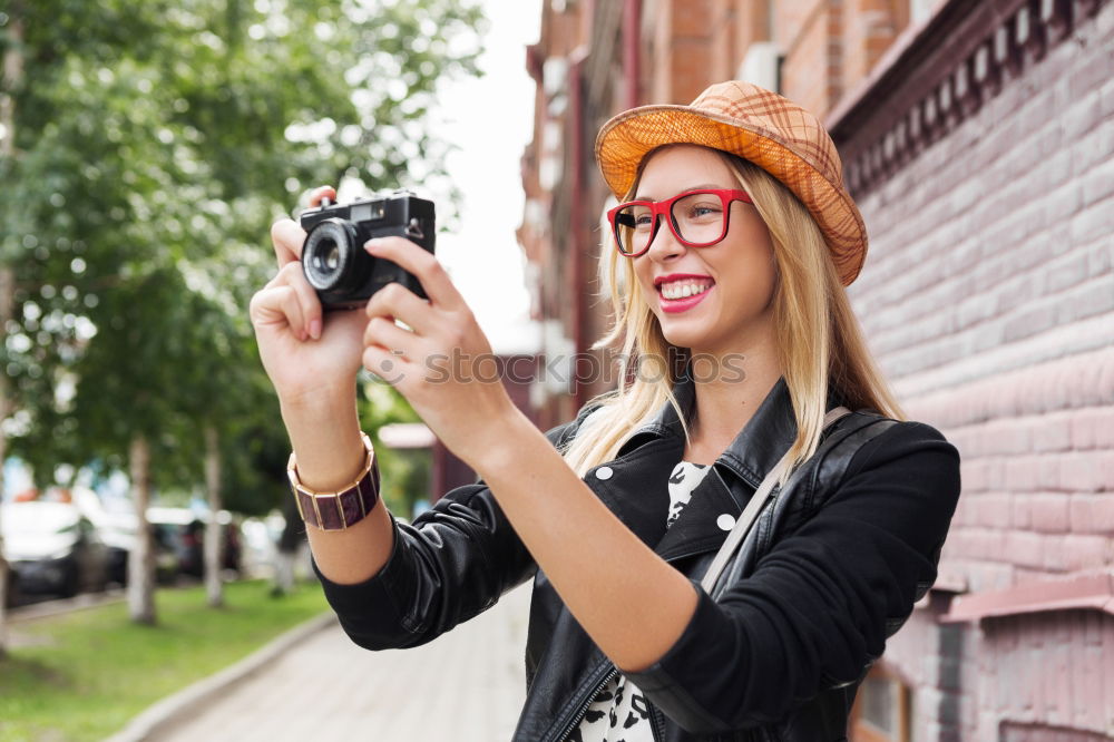 Similar – Image, Stock Photo Happy young woman with her mobile on the street