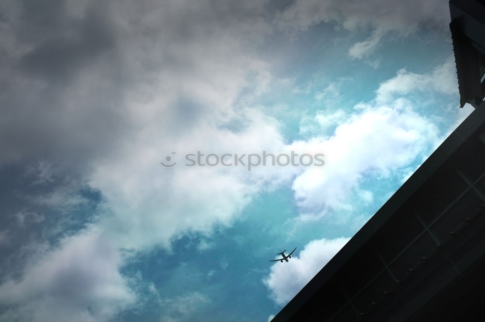 Similar – MÖVEN + HAUS + LATERNE + KONDENZSTREIFEN + WOLKEN + HIMMEL