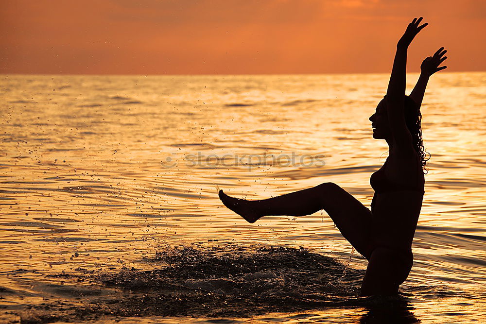 Similar – Father and son playing on the beach at the sunset time.