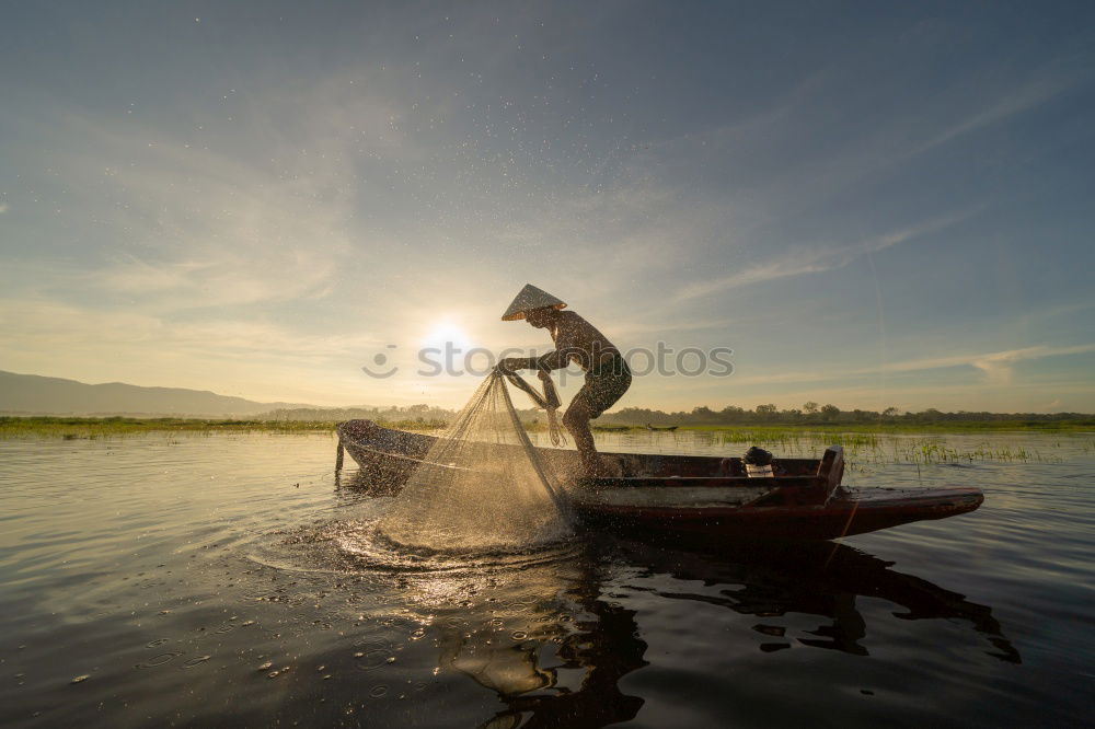 Similar – Image, Stock Photo Boy sitting on air-filled plastic crocodile in a lake