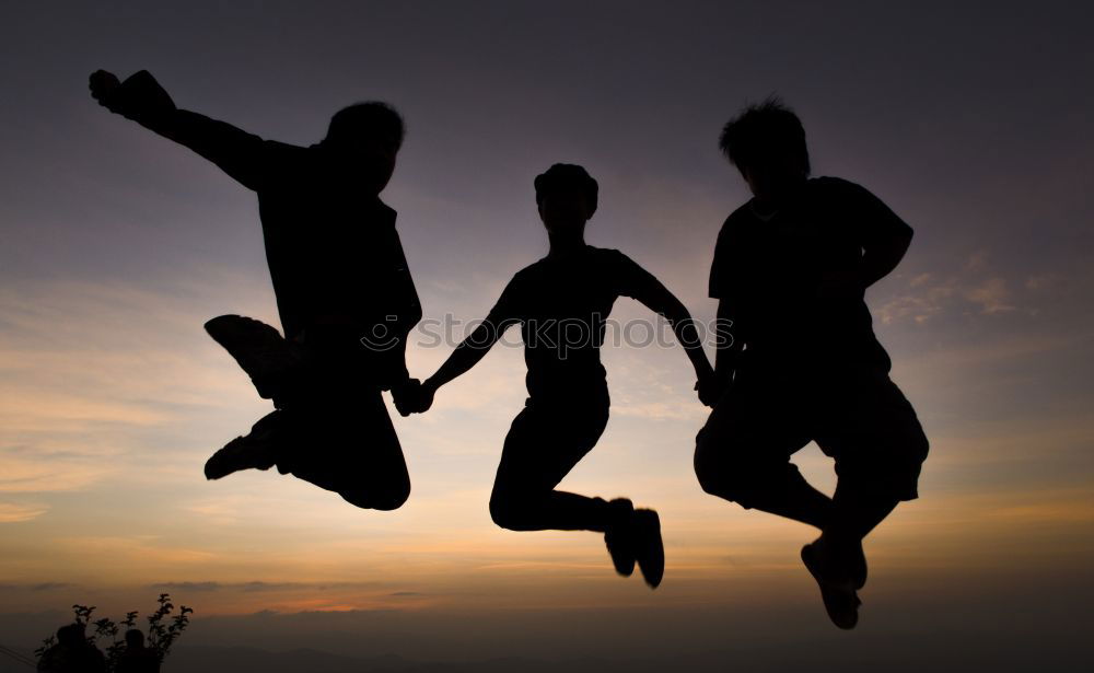 Similar – Four people jumping at sunset.