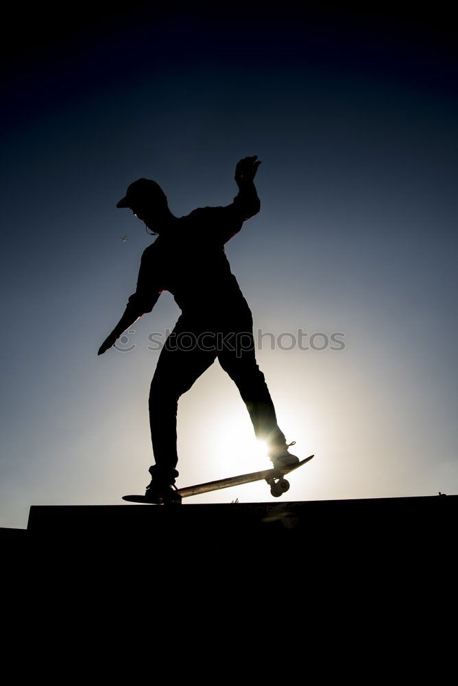 Similar – Skateboarder in Silhouette