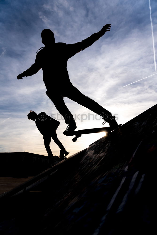 Similar – Skateboarder in Silhouette