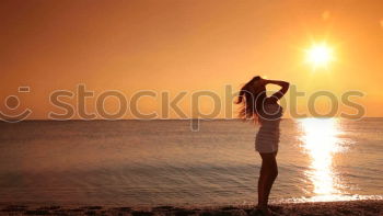 Similar – Happy little girl jumping on the beach at the sunset time