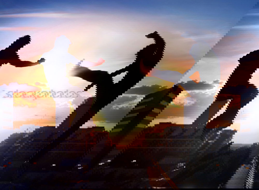 Similar – Image, Stock Photo Young multirracial couple jumping happy at sunset on the rooftop