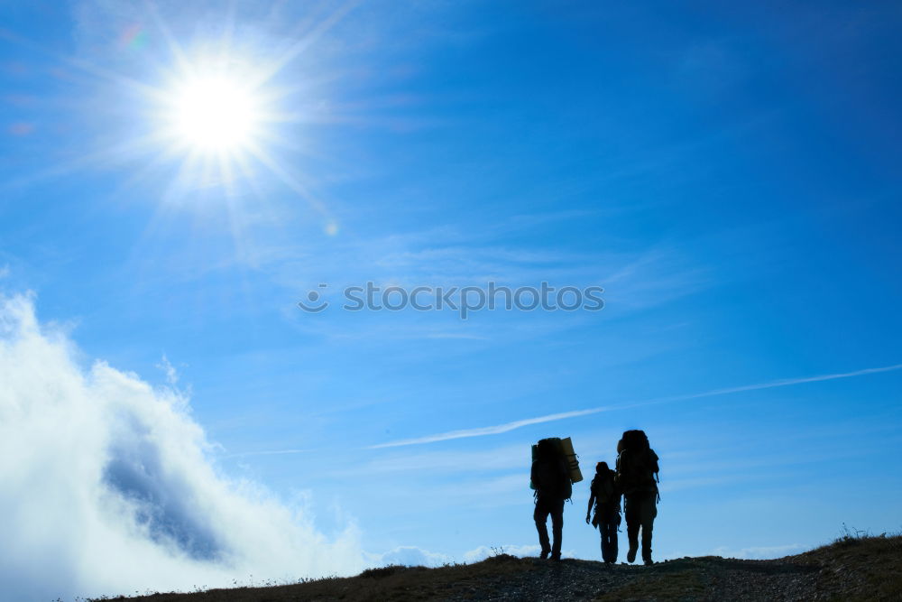 Image, Stock Photo Silhouette of hiking friends against sun