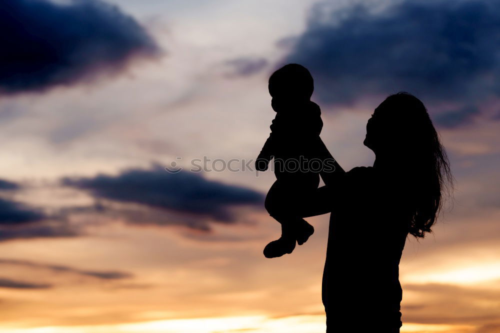 Similar – Father and son playing on the beach at the sunset time.