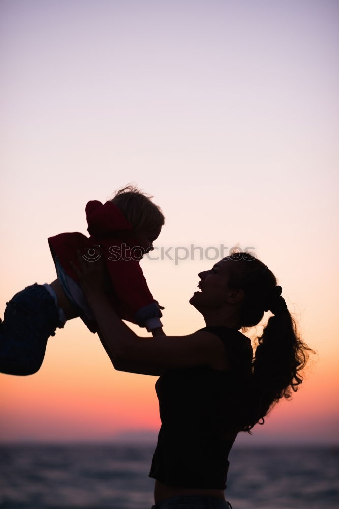 Similar – Father and son playing on the beach at the day time. Concept of friendly family.