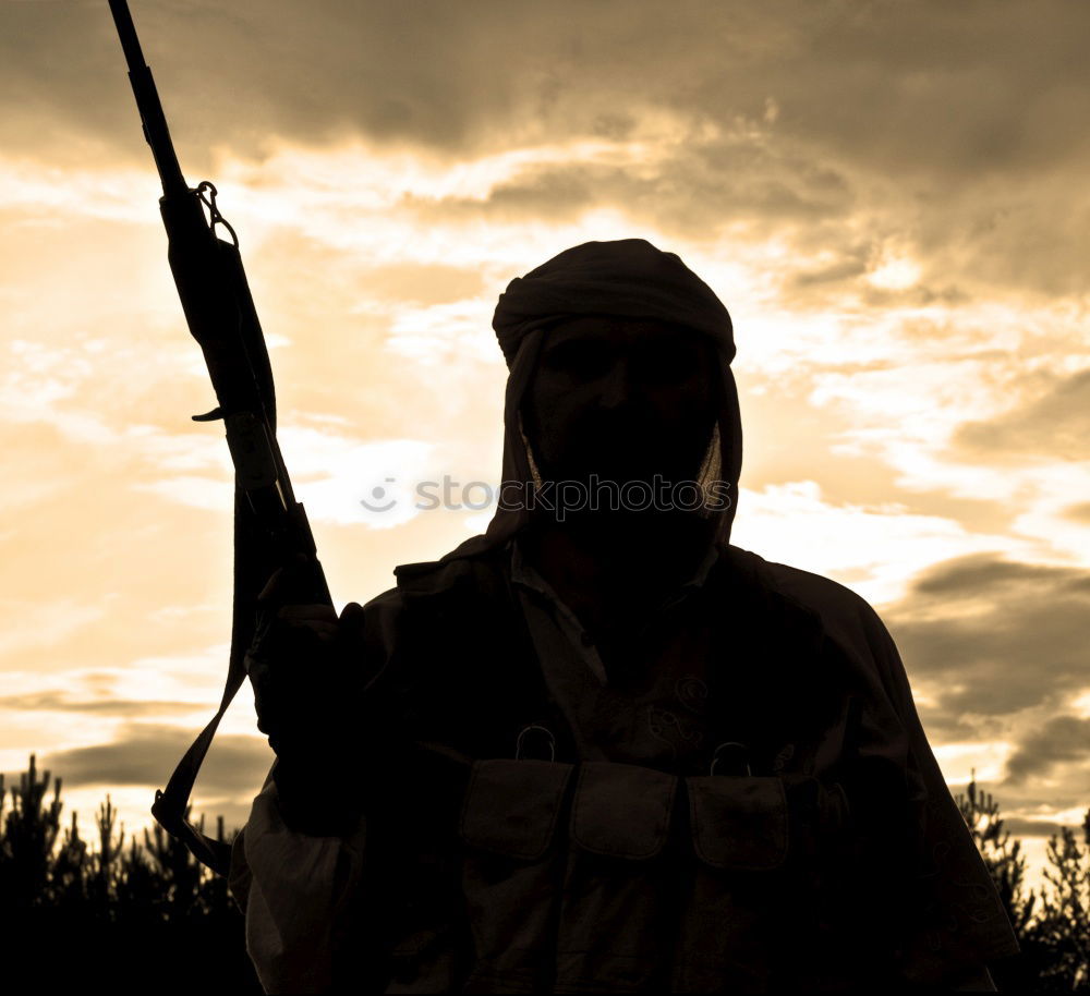 Similar – Hunter is happy about his prey he shot in wilderness and smiling