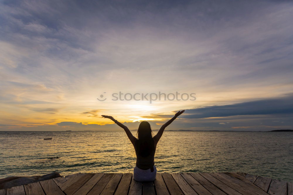 Similar – Athletic man balancing on gymnastic rings