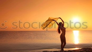 Similar – One happy little girl playing on the beach at the sunset time.