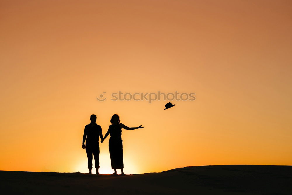 Similar – Image, Stock Photo Mother and son playing on the coast of lake at the sunset time