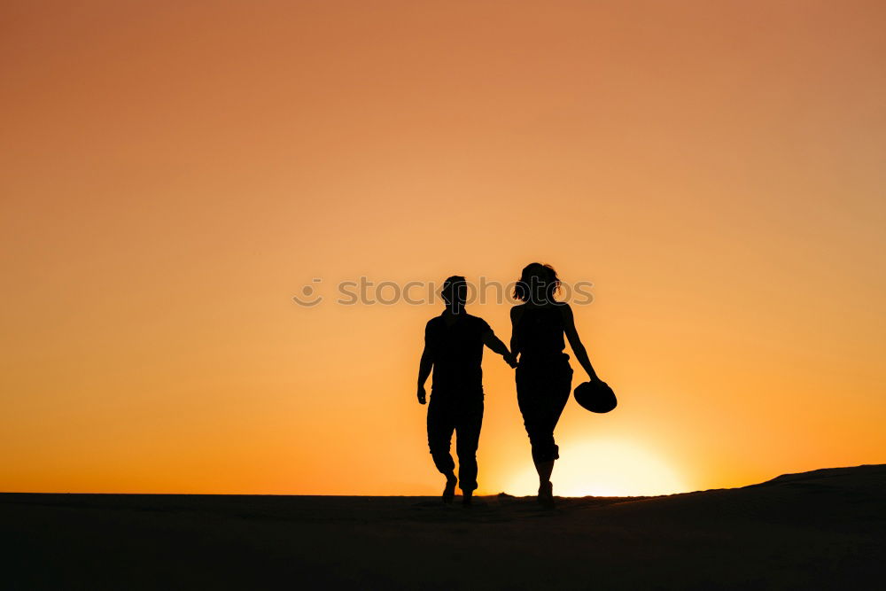 Similar – Image, Stock Photo Mother and son playing on the coast of lake at the sunset time