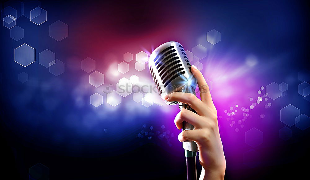 Similar – Woman holding microphone with two hands over black