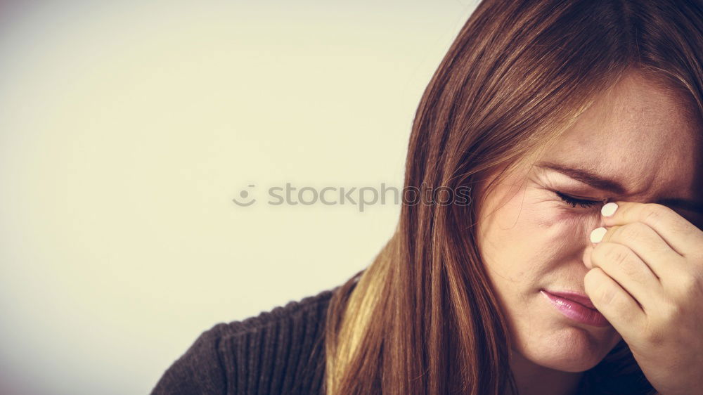 Similar – Image, Stock Photo one sad woman sitting near a wall and holding her head in her hands