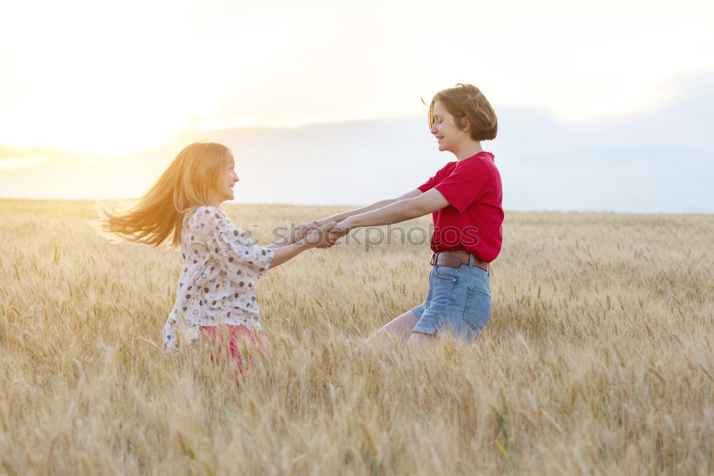 Similar – Sister and brother playing on the beach