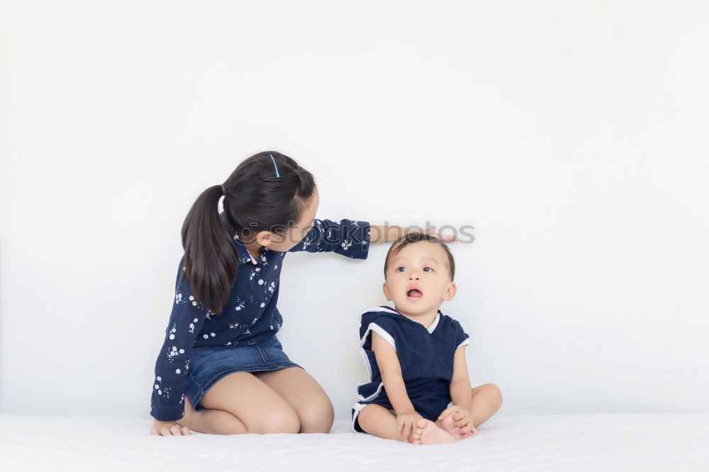 Similar – happy mother and child son fooling and playing in bed